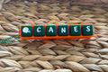 Keychain with 'CANES' letters on a woven surface